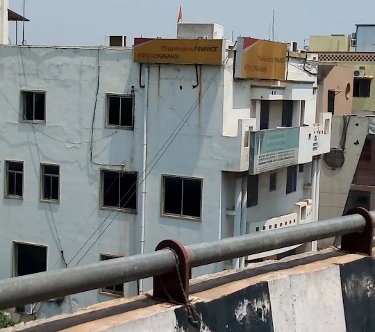 Mahindra Finance office near Rasulgarh Overbridge Bhubaneswar with yellow Mahindra Finance signboard